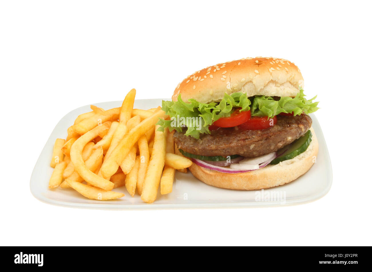 Beefburger in a bun with French fries on a plate isolated against white Stock Photo