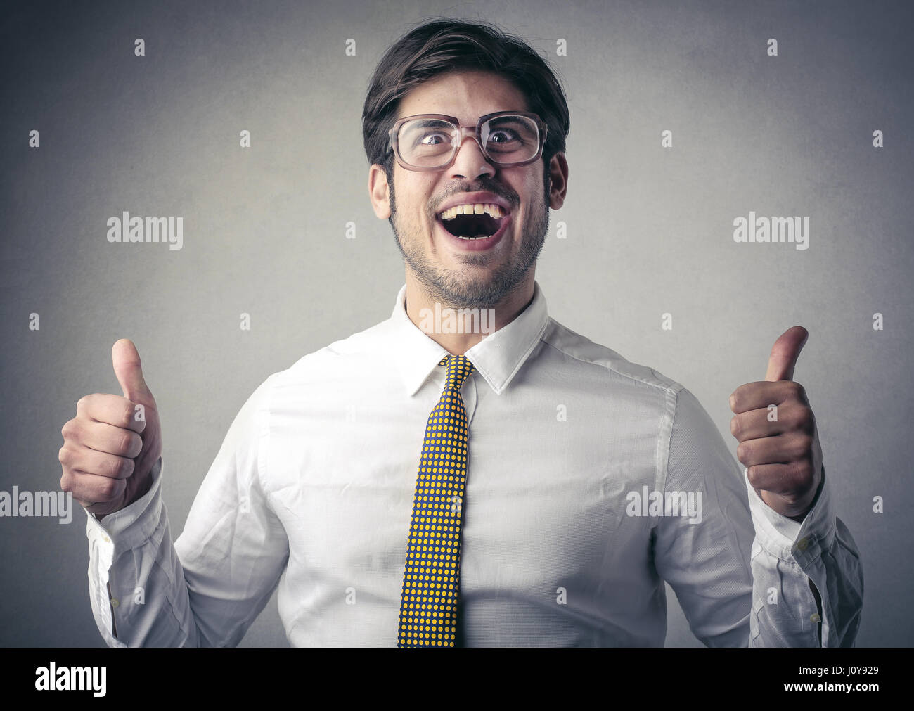 Nerdy businessman showing like sign Stock Photo Alamy