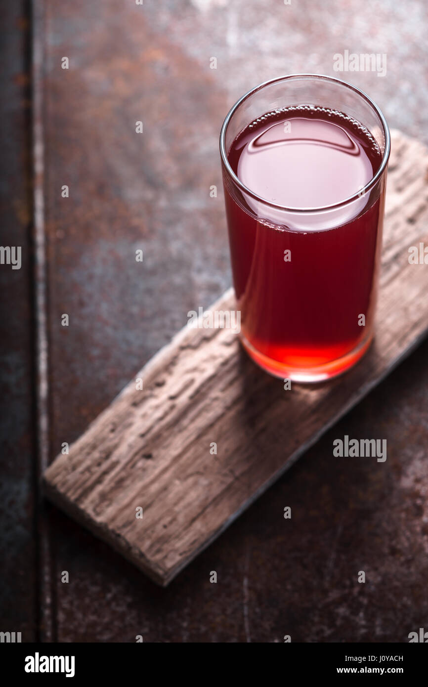 Cranberry drink in a glass on the tabie vertical Stock Photo