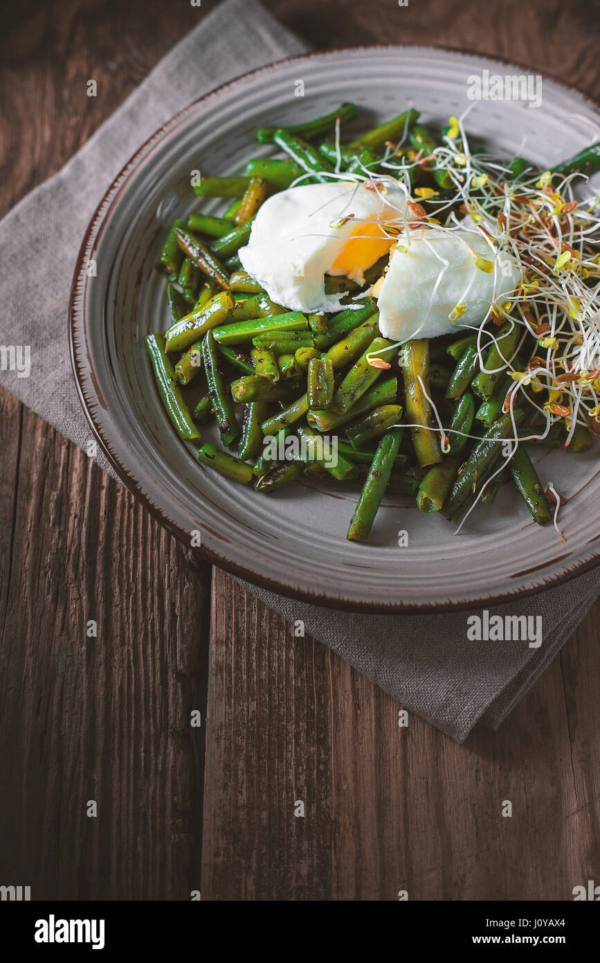Salad with green beans, flax and quail eggs vertical Stock Photo Alamy