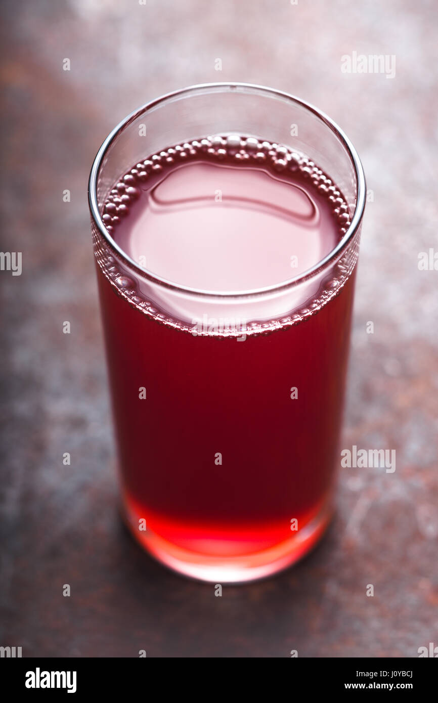 Berry juice on the metal background vertical Stock Photo