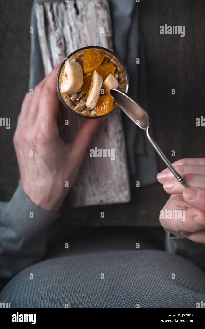 Fruit and yogurt dessert on the wooden background top view Stock Photo