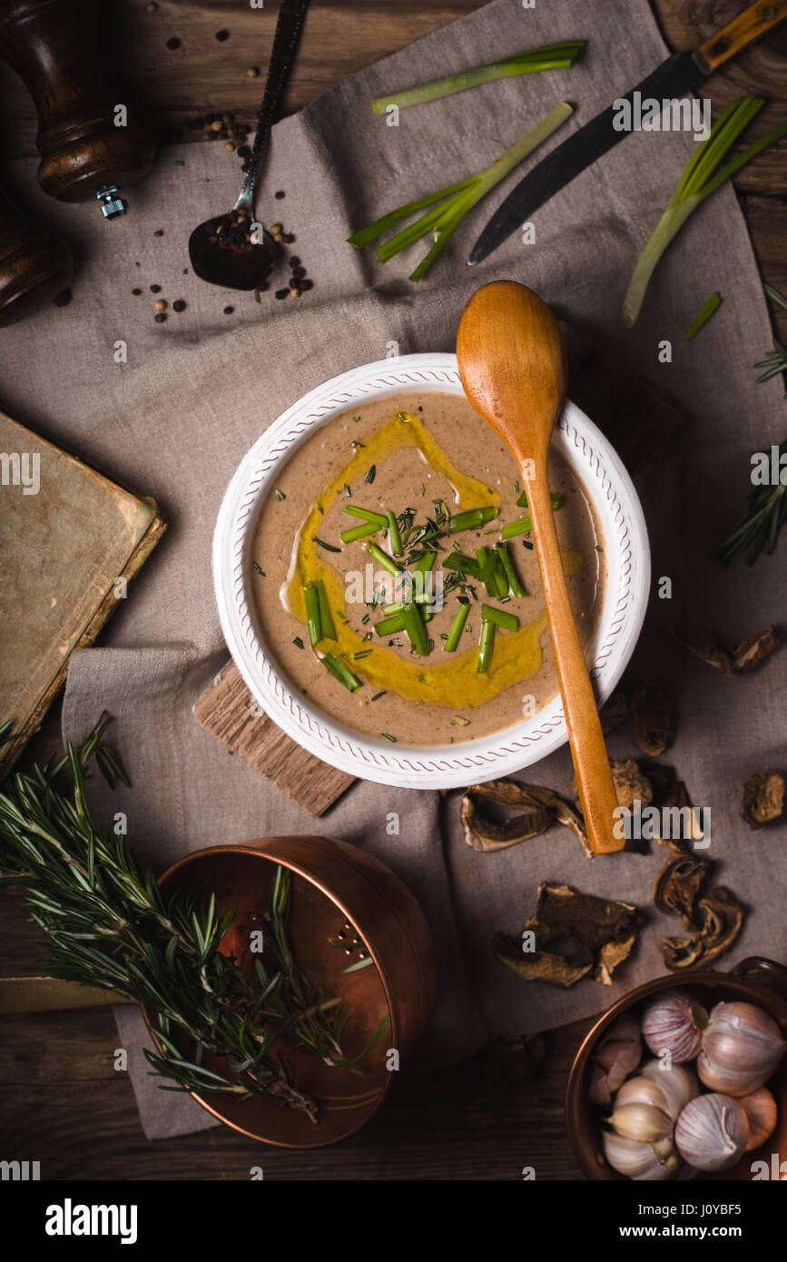 Mushroom cream soup on the wooden background top view Stock Photo