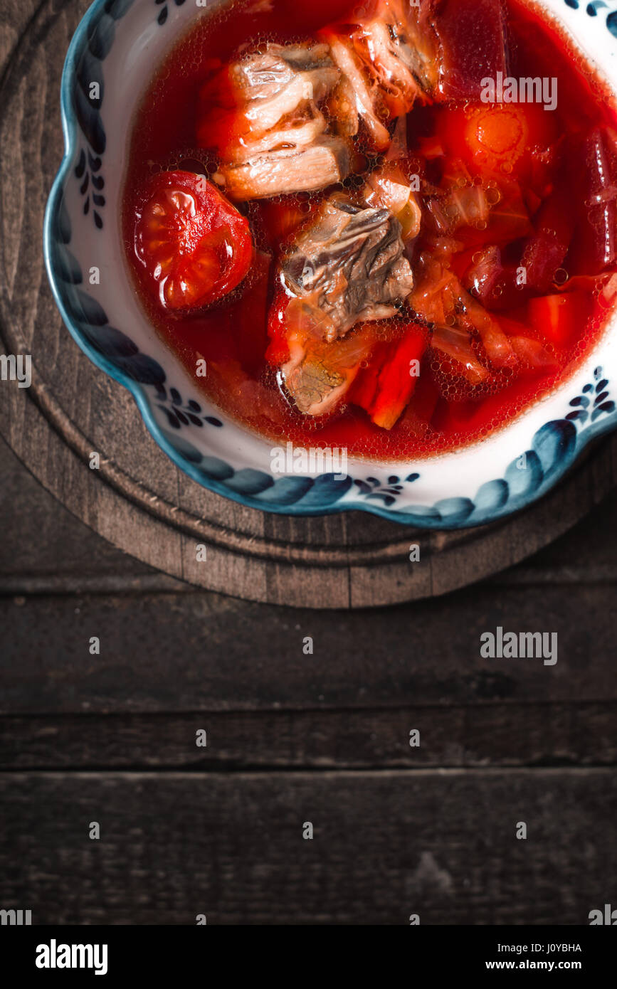 Traditional Russian and Ukrainian beetroot soup borscht  on the old background Stock Photo