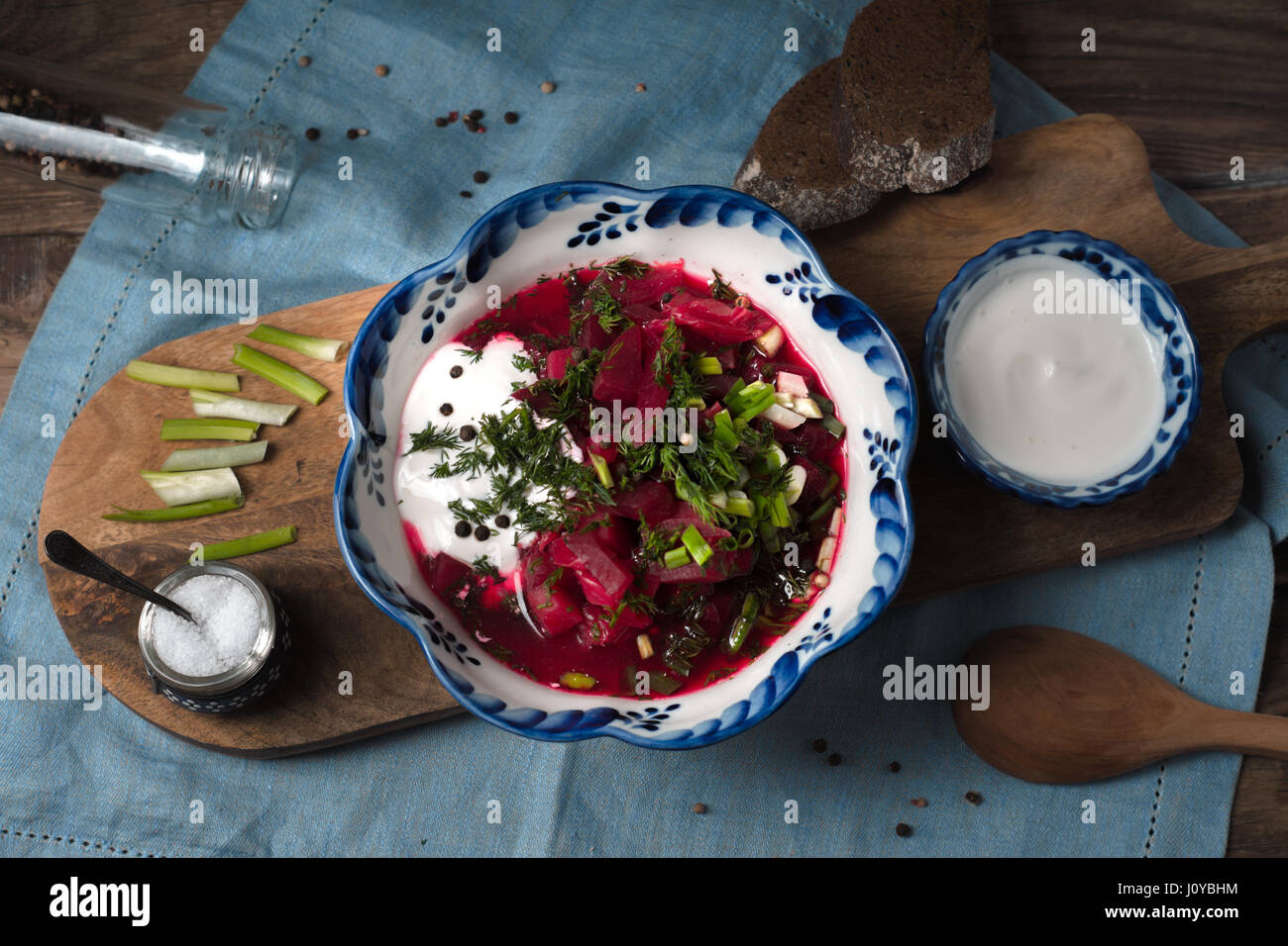 Traditional Russian and Ukrainian beetroot soup borsch with sour cream  greens top view Stock Photo