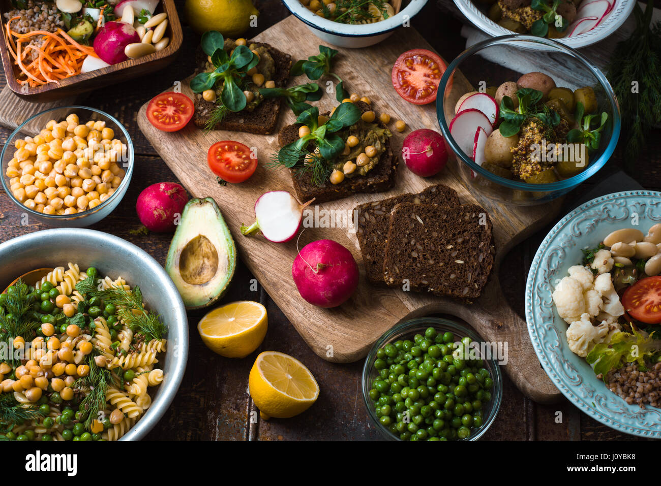 Different salad and snack on the wooden table horizontal Stock Photo