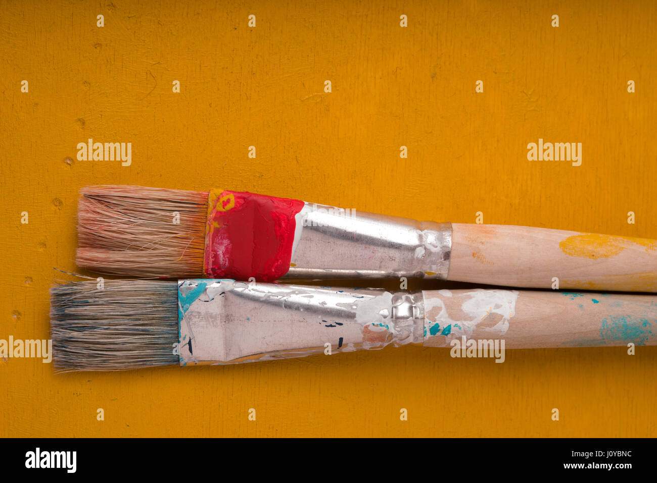 A close up of paint and brushes on a table Image & Design ID 0000370069 