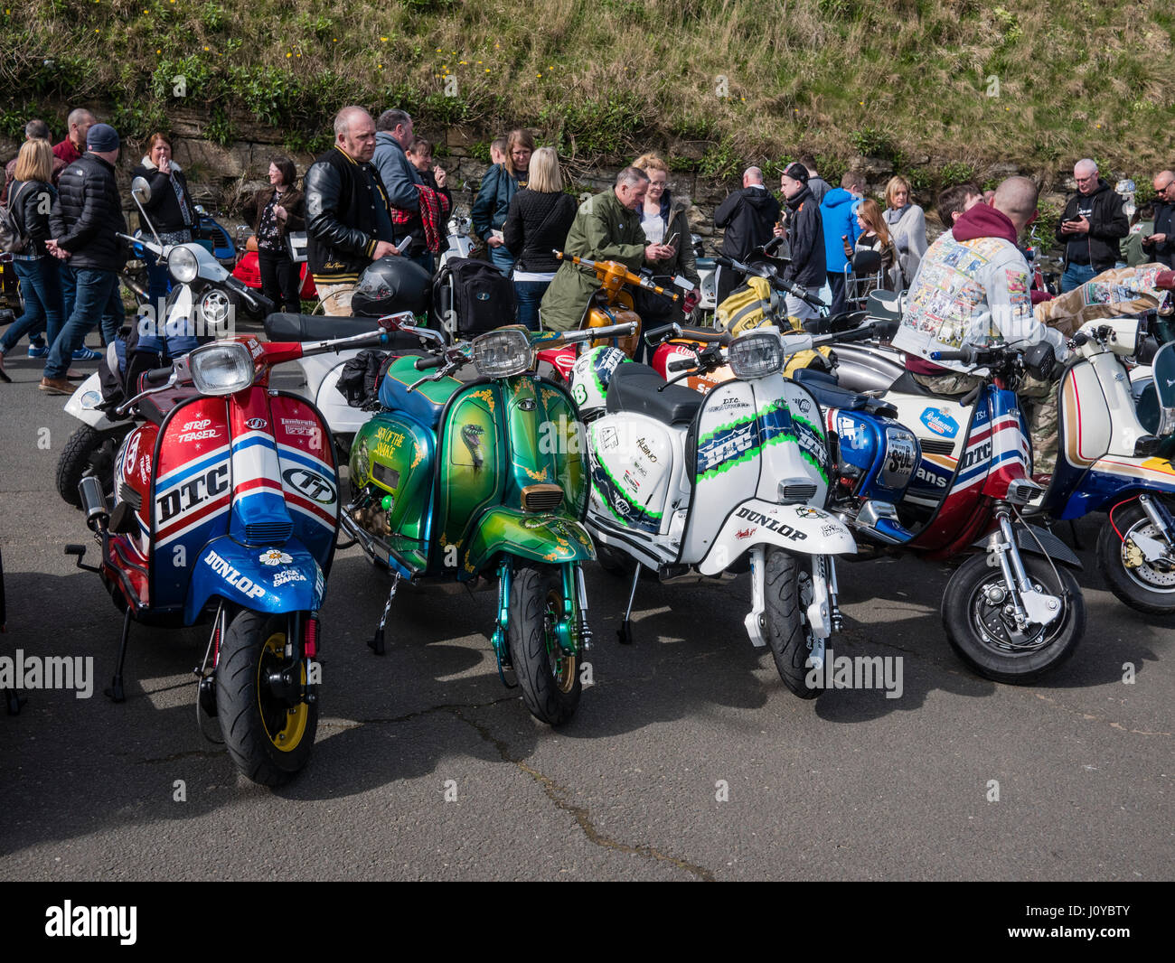 Inspecting scooters at the National Scooter Rally Easter 2017 based at the Spa  Scarborough Yorkshire UK Stock Photo