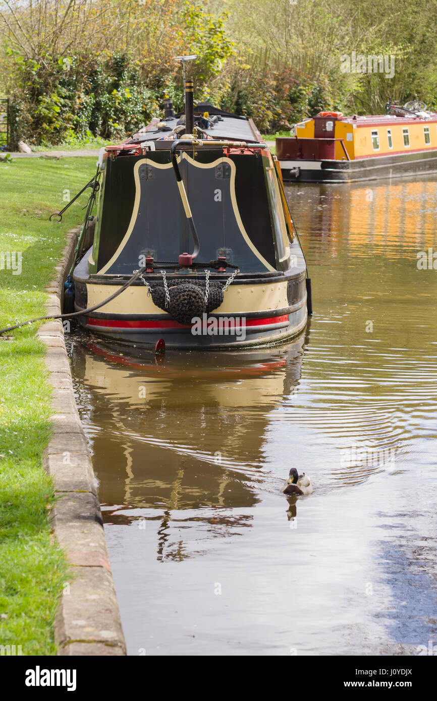 Barges moored up on the Llangollen canal a popular holiday getaway and alternative lifestyle on the rural inland waterway network Stock Photo