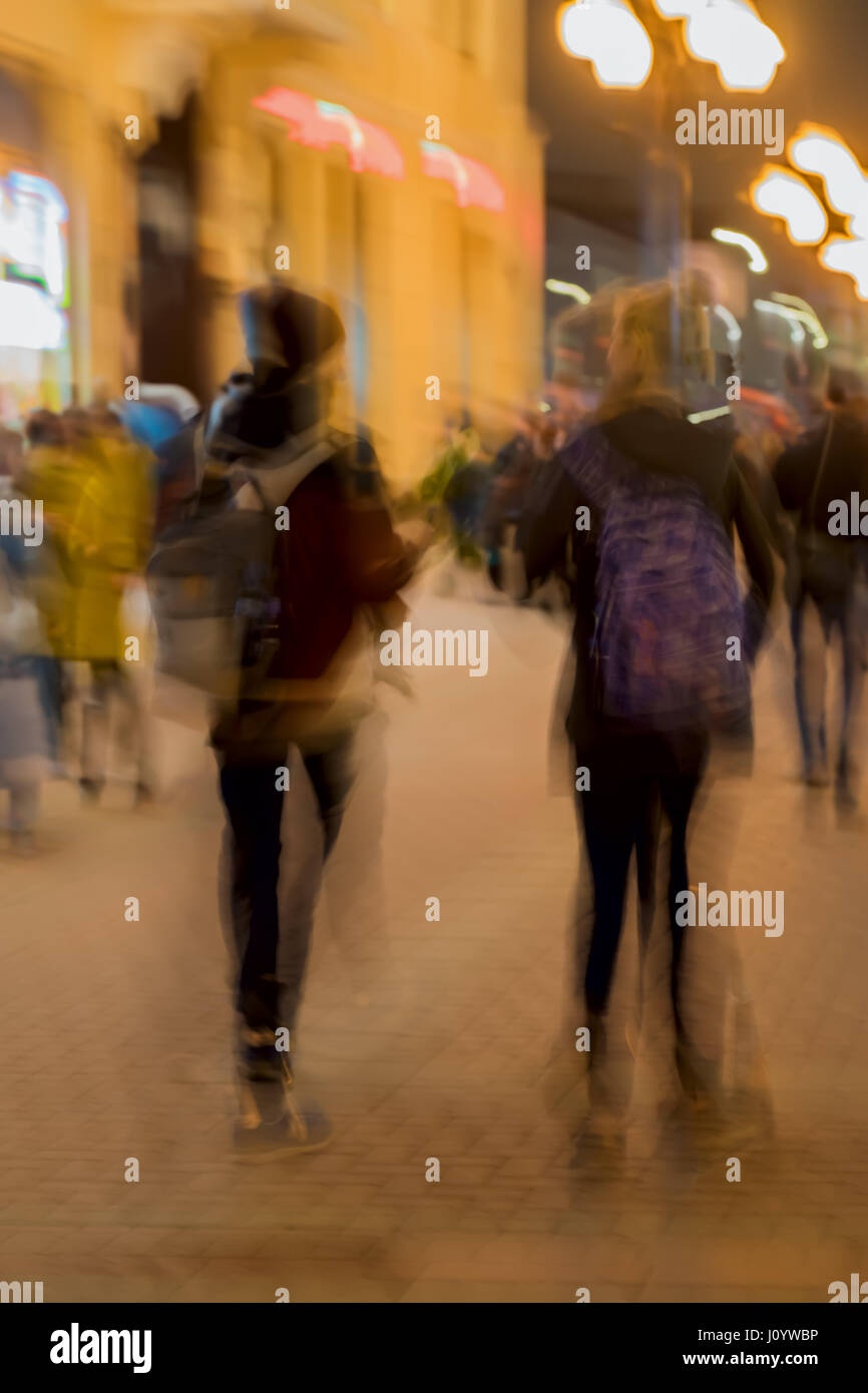 Abstract vintage tone motion. Blur image of Street, girl and guy with a backpacks, bright city lights with bokeh. Concept of Shopping, walking, lifestyle, love Photo - Alamy