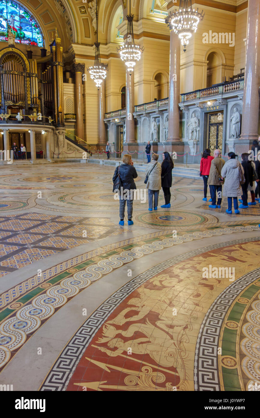 St George's Hall Liverpool. Visitors on the Minton Tiled floor of the Great Hall. An encaustic tiled floor of more than 30,000 handcrafted tiles. Stock Photo