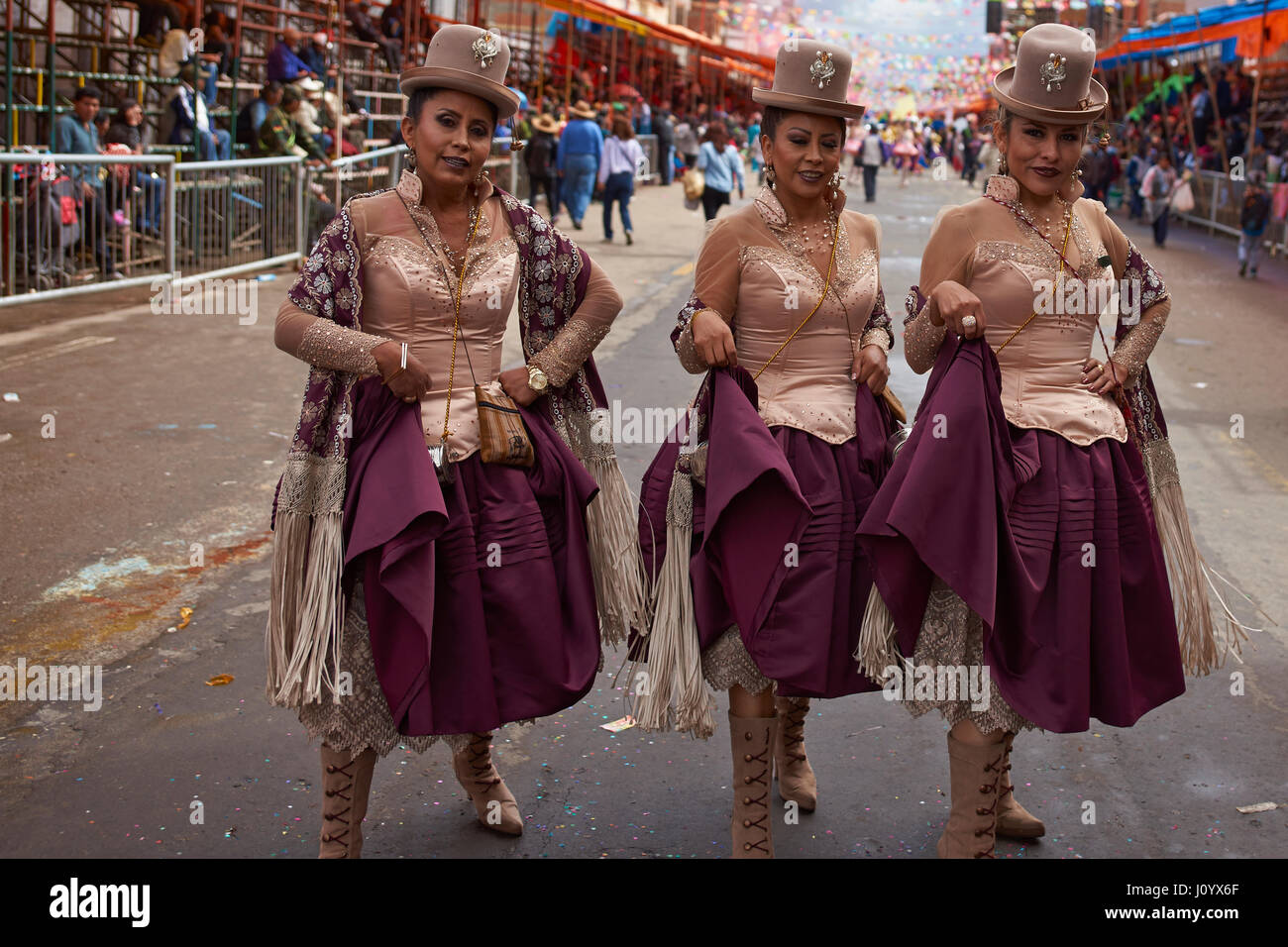 Morenada dance group in colourful outfits parading through the mining city of Oruro on the Altiplano of Bolivia during the annual Oruro Carnival. Stock Photo