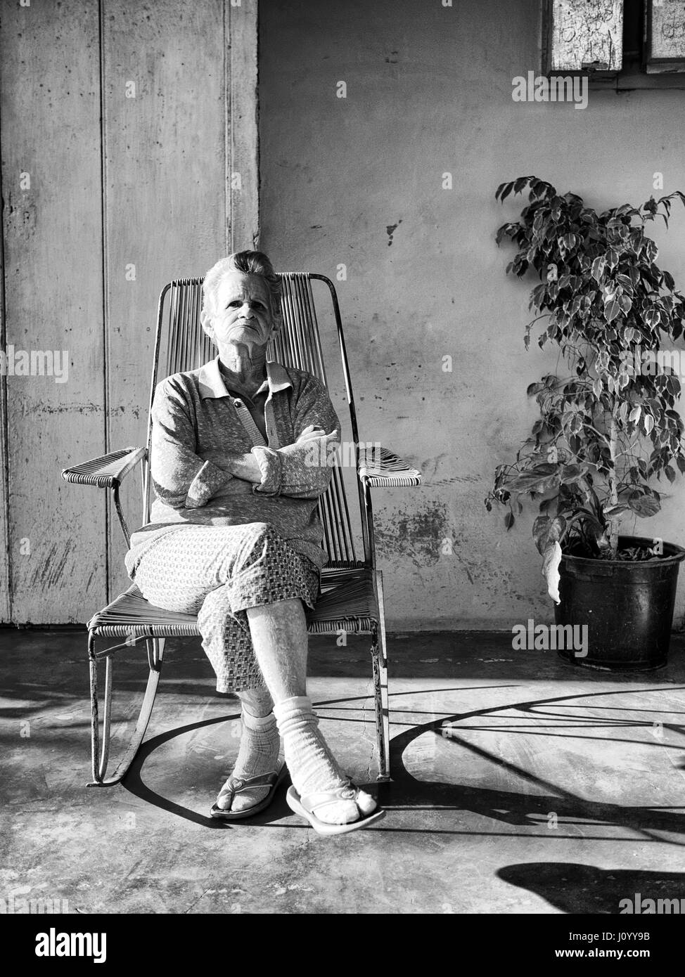 Woman sitting on porch veranda Black and White Stock Photos & Images ...
