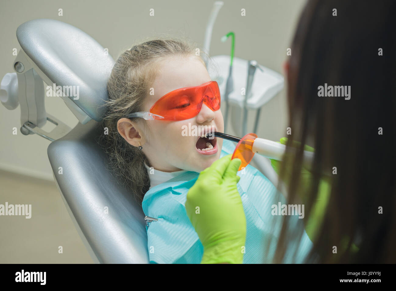 Dentist preparing ultraviolet light Stock Photo Alamy