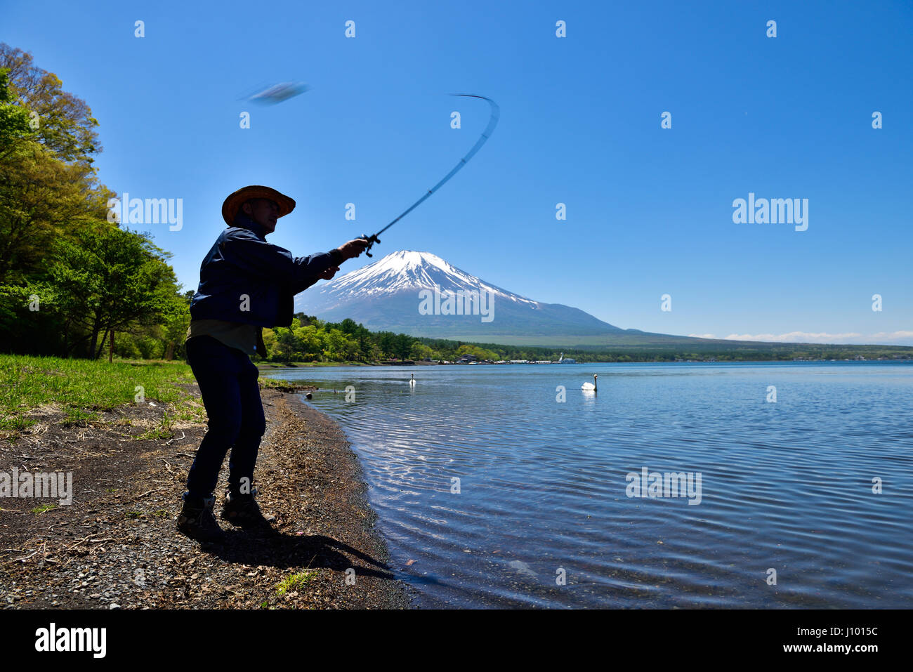 Fisherman at Lake Yamanaka and Mt. Fuji Stock Photo
