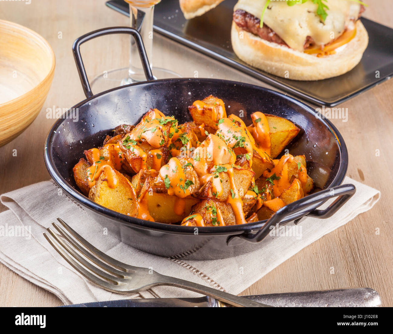 Patatas bravas, spicy potatoes, a typical Spanish dish with fried