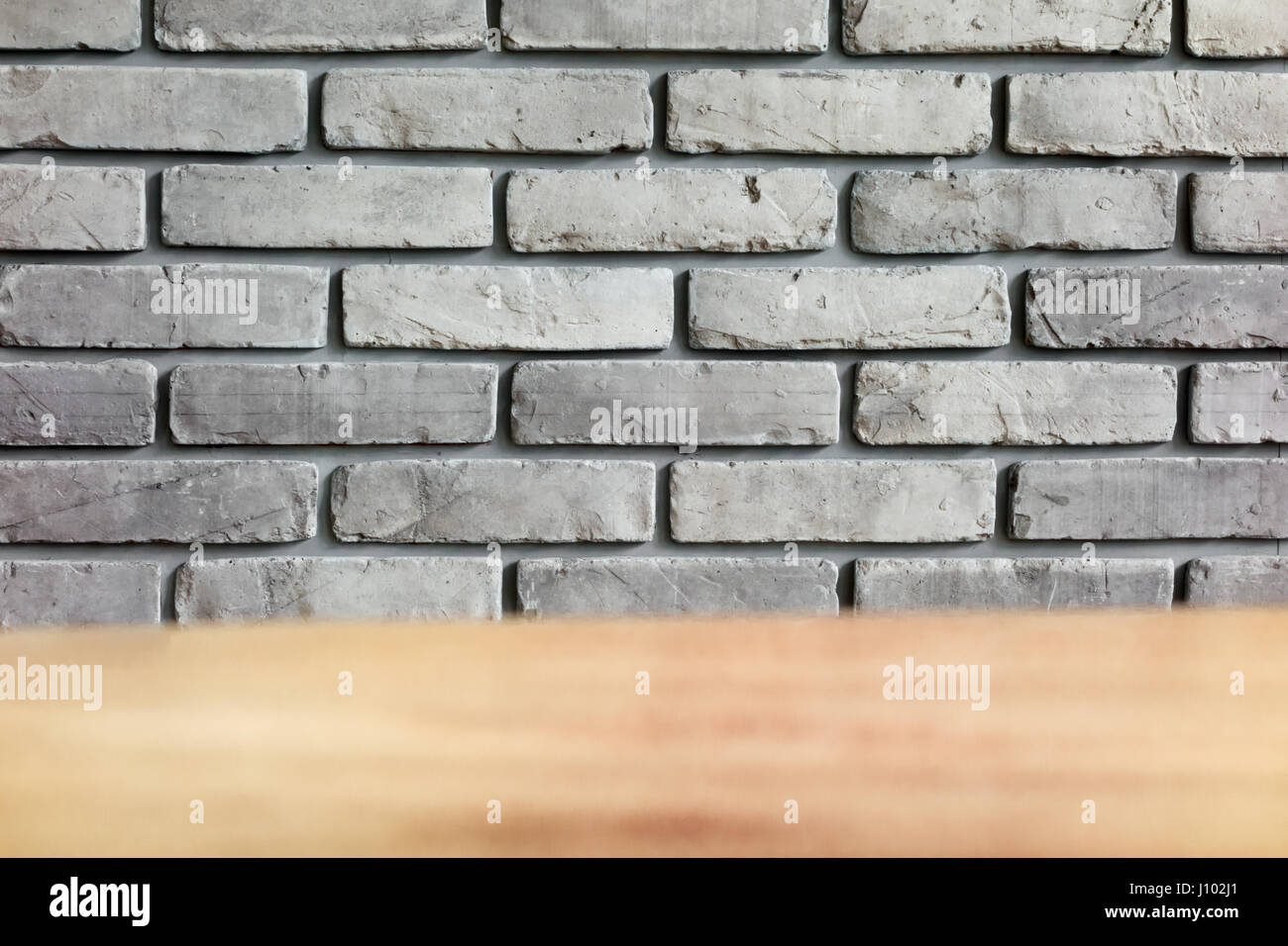 Rule Grey Brick wall with table foreground Stock Photo