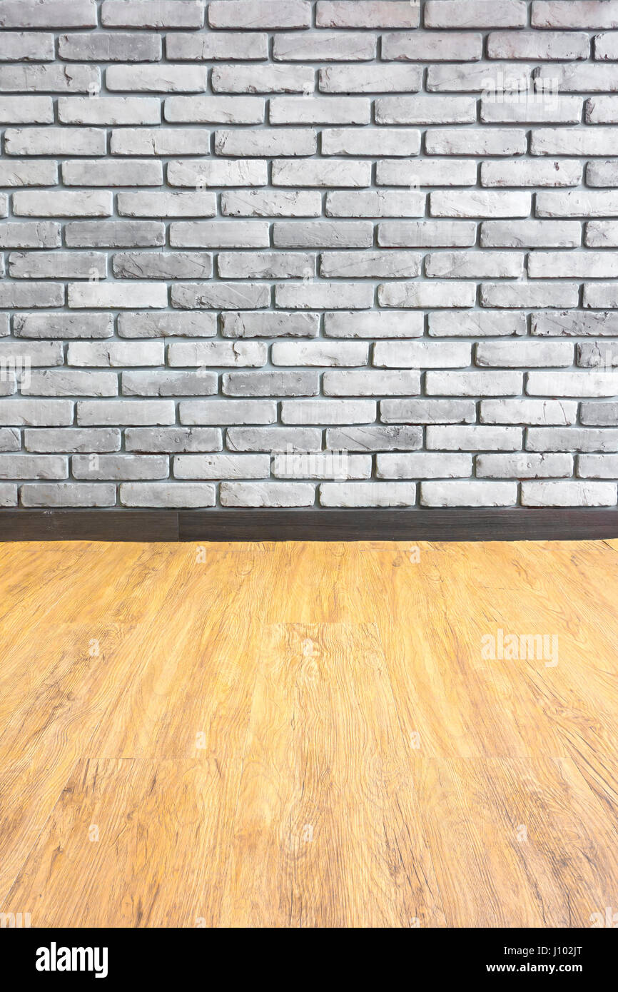 Empty interior perspective with brick wall and wood parquet. Stock Photo