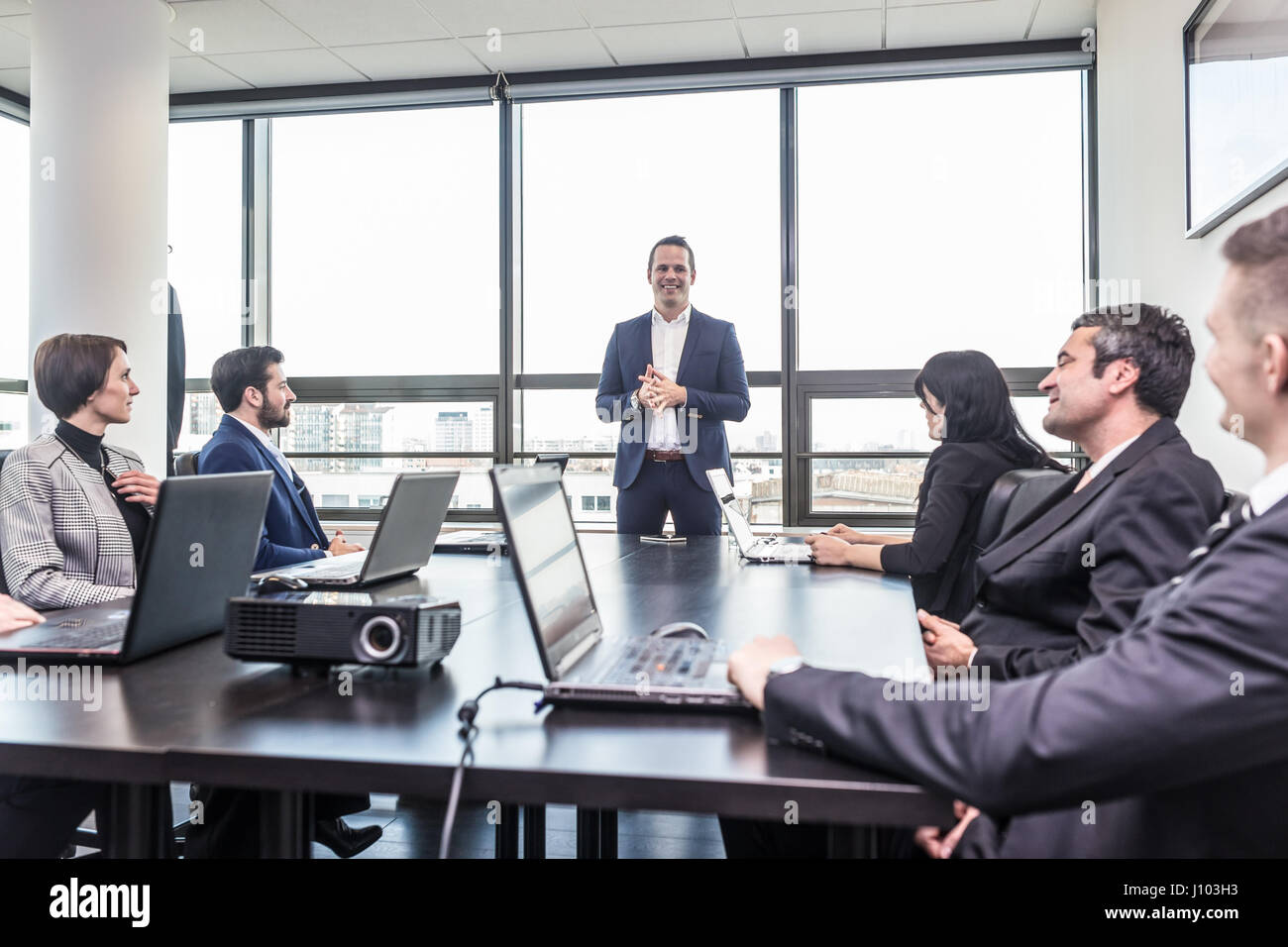 Corporate business team office meeting Stock Photo - Alamy