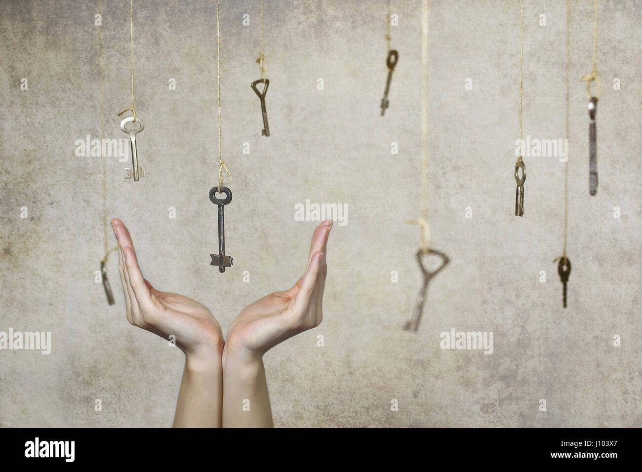 hand stretching for one of the many old vintage keys Stock Photo - Alamy