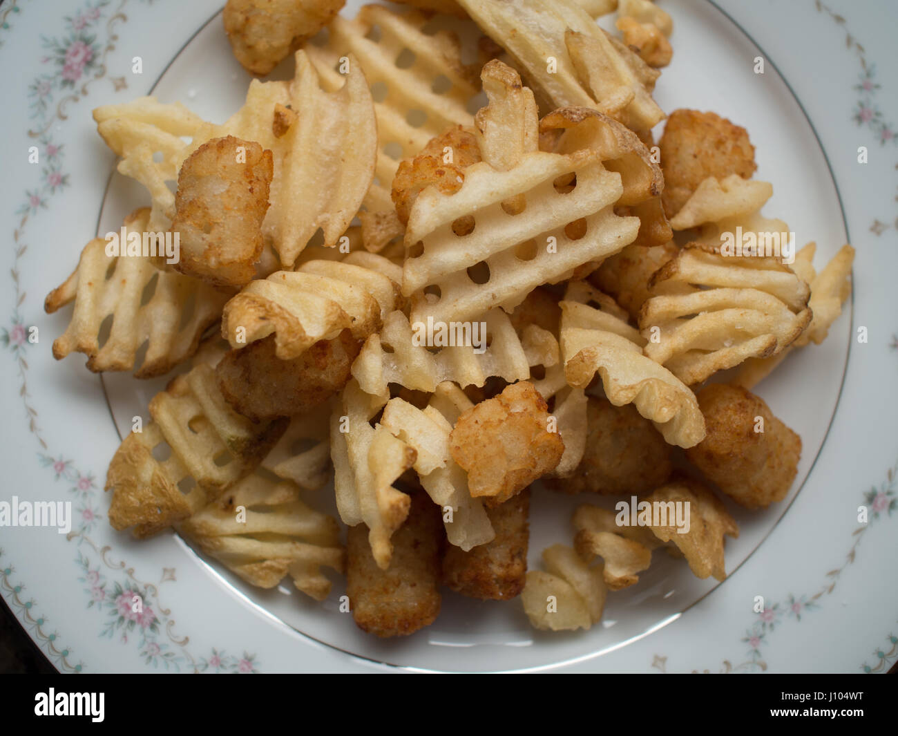 Carbohydrate overload A plate full of waffle fries and tater tots