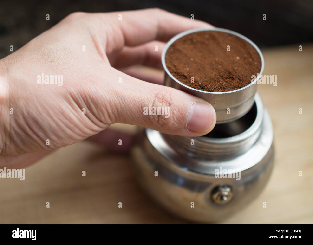 Using a moka pot to make espresso on a stove Stock Photo