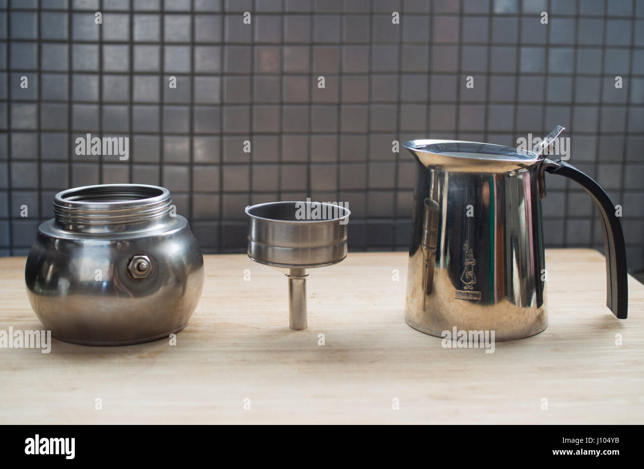Using a moka pot to make espresso on a stove Stock Photo