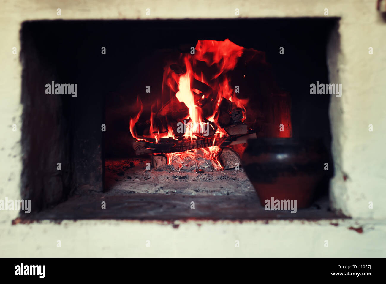 pot in the oven and oven fork Stock Photo Alamy