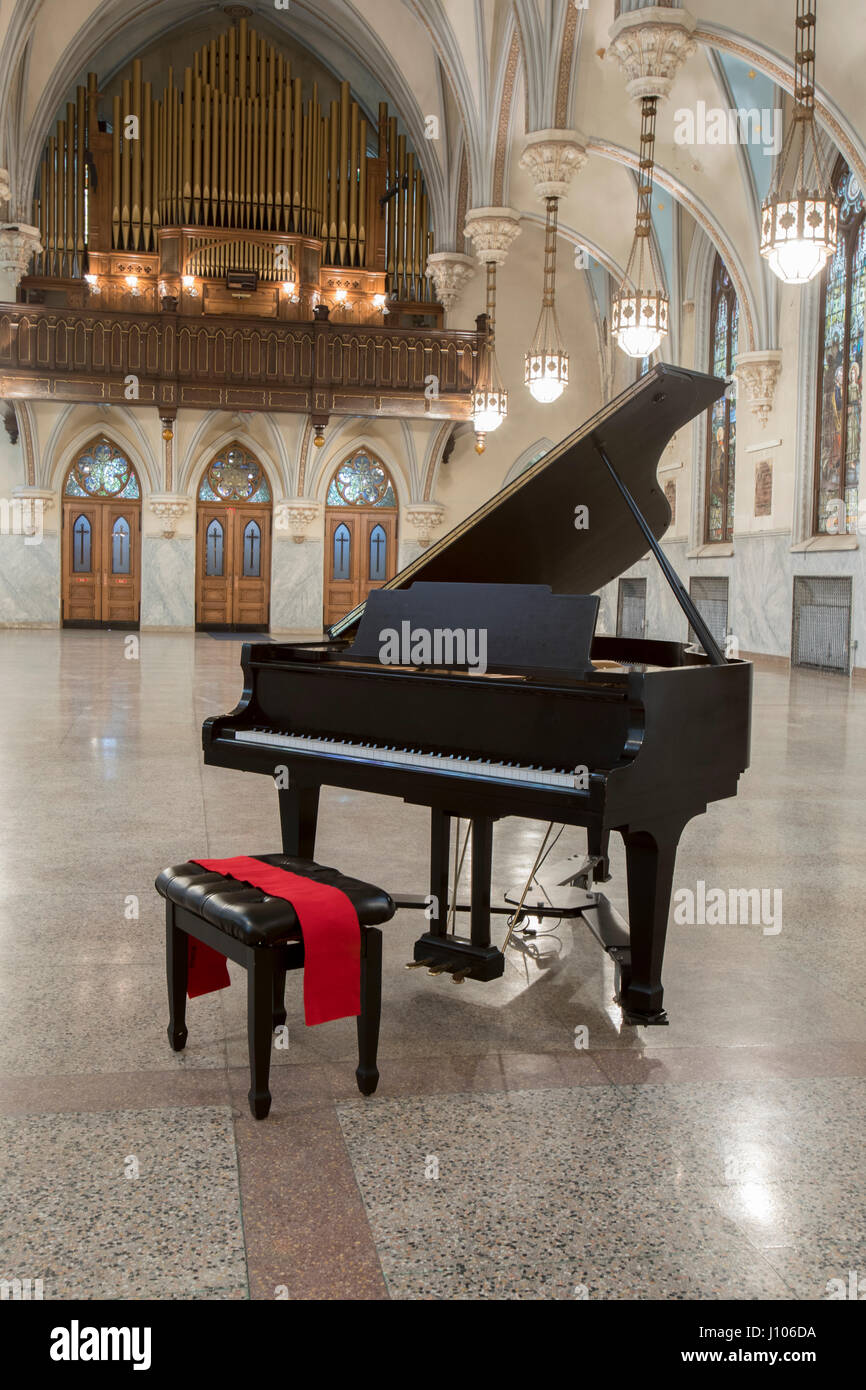 Black grand piano in empty hall of gothic German church Stock Photo - Alamy