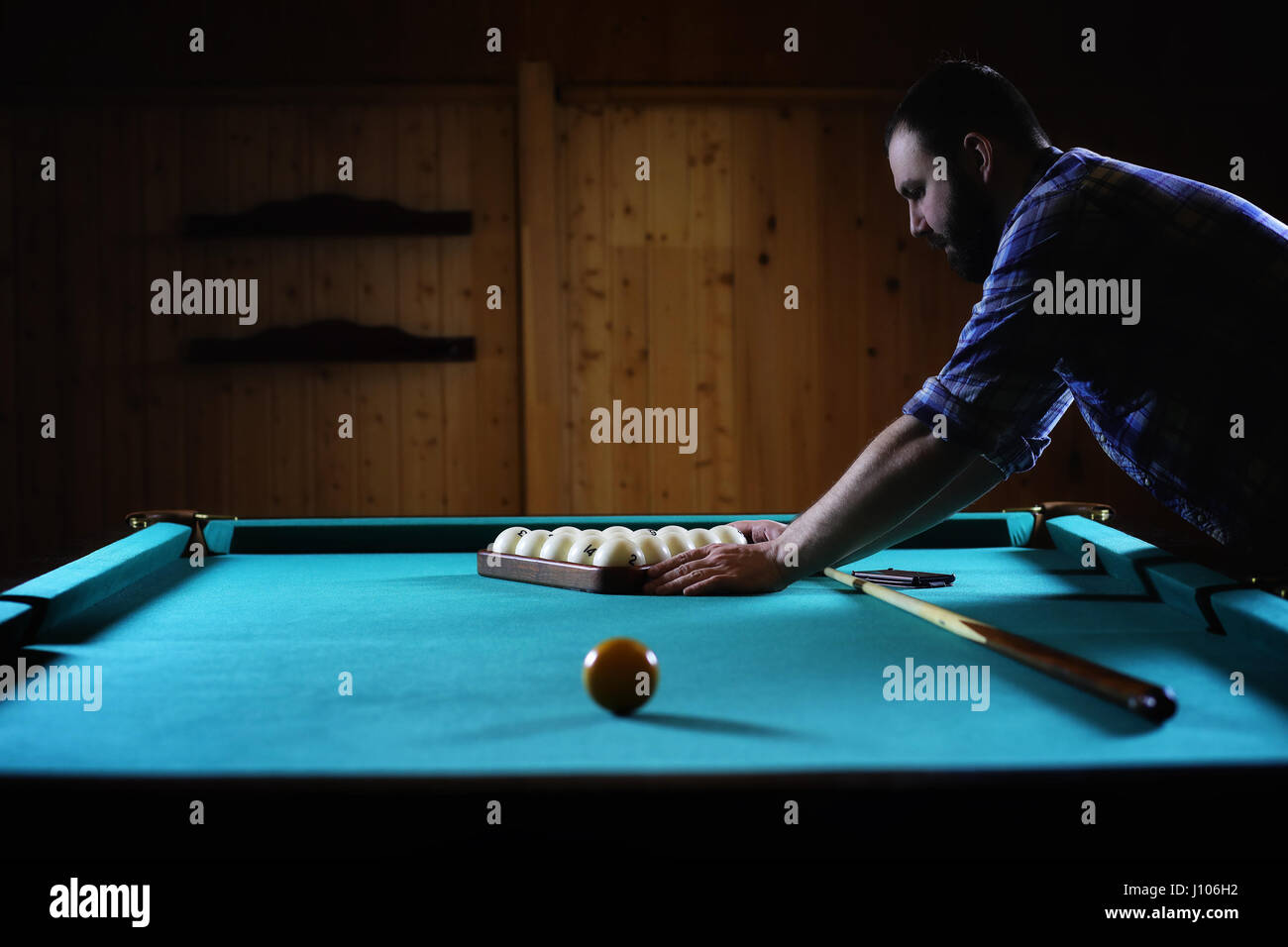 hansome man playing billiards alone Stock Photo Alamy