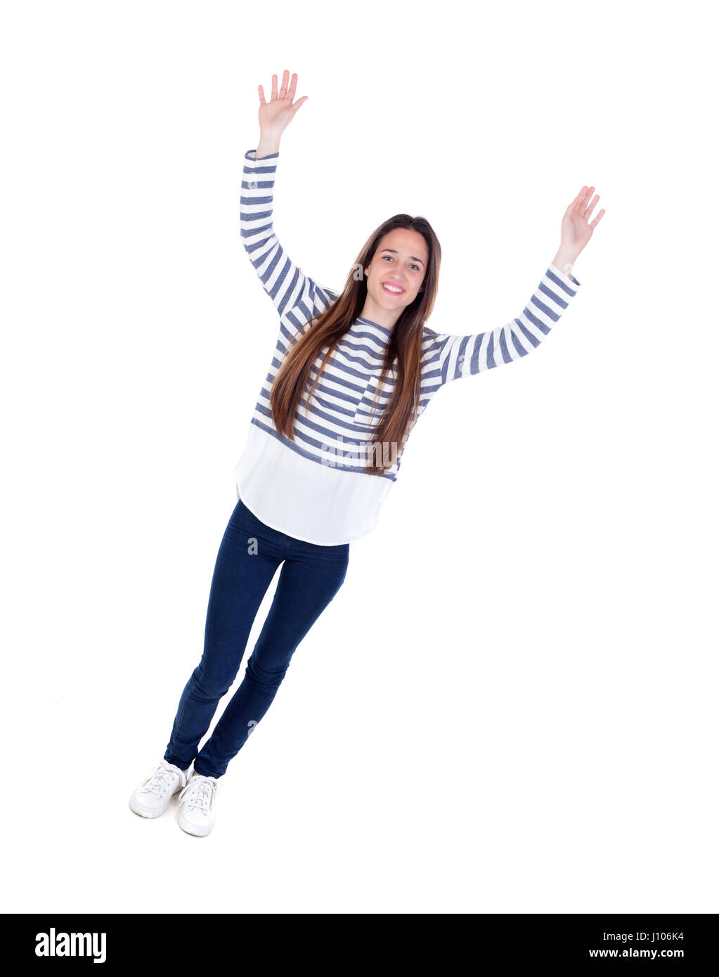 Happy teenager girl celebrating something leaving her hands isolated on a  white background Stock Photo - Alamy