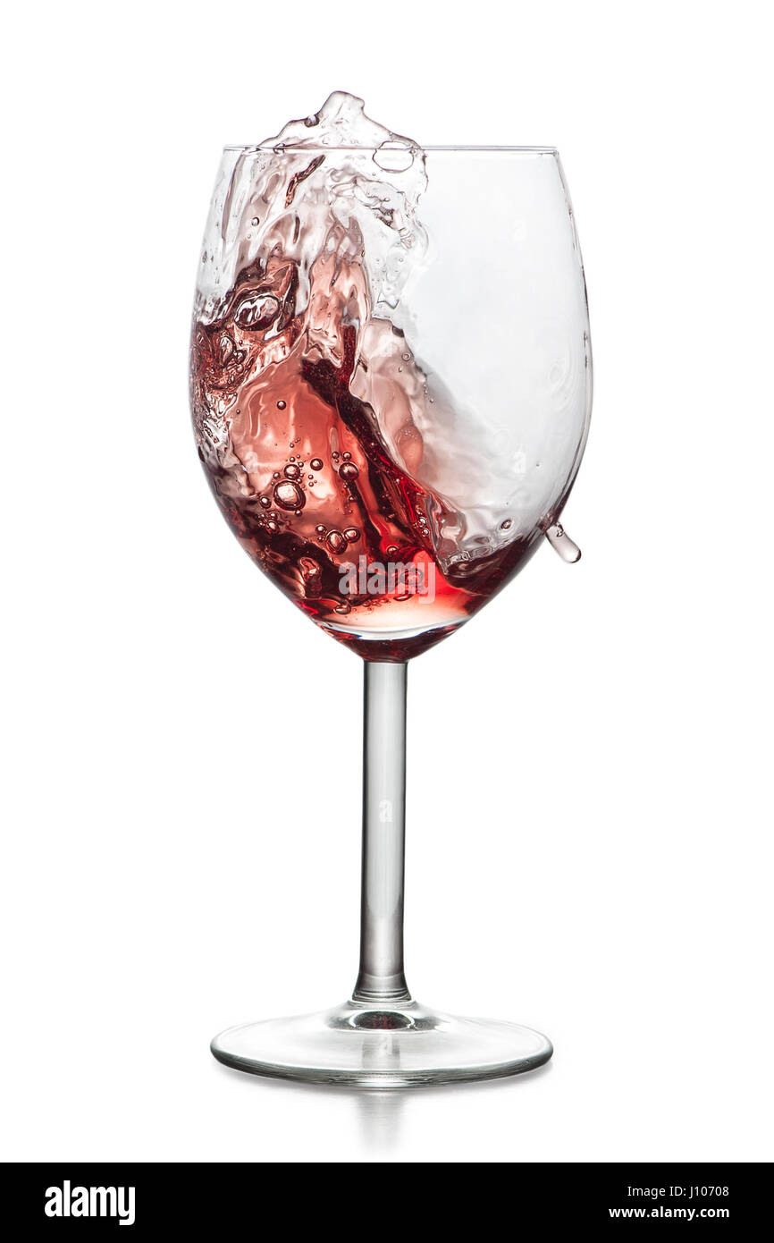 Moving red wine glass over a white background Stock Photo - Alamy