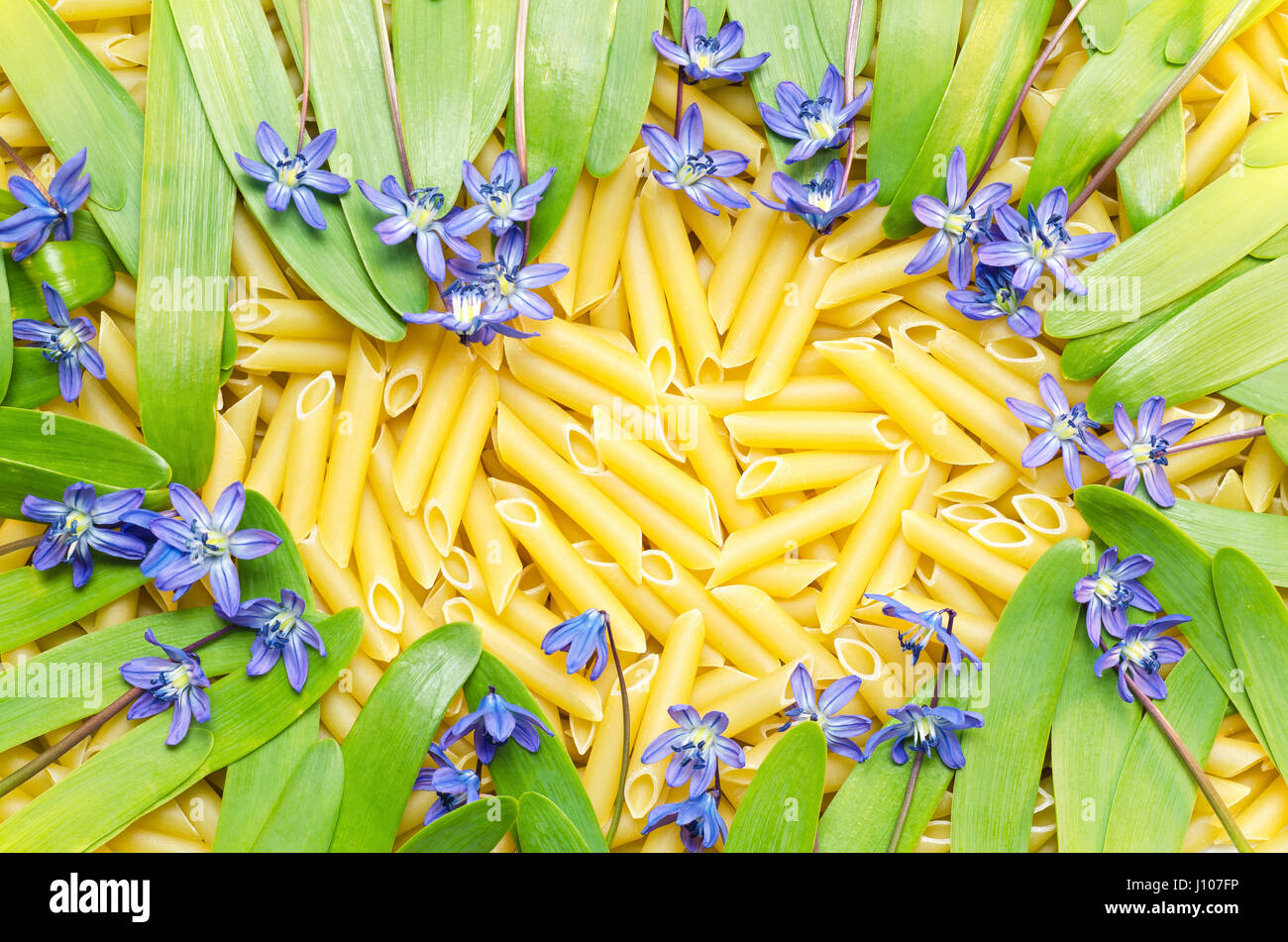 Background of pasta, green onions and flowers Stock Photo Alamy
