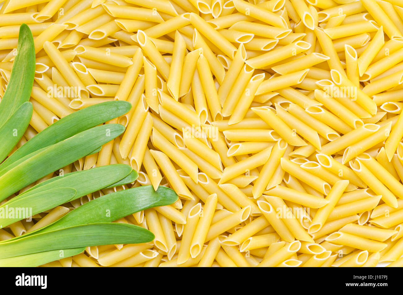 Background of pasta and green onions Stock Photo Alamy