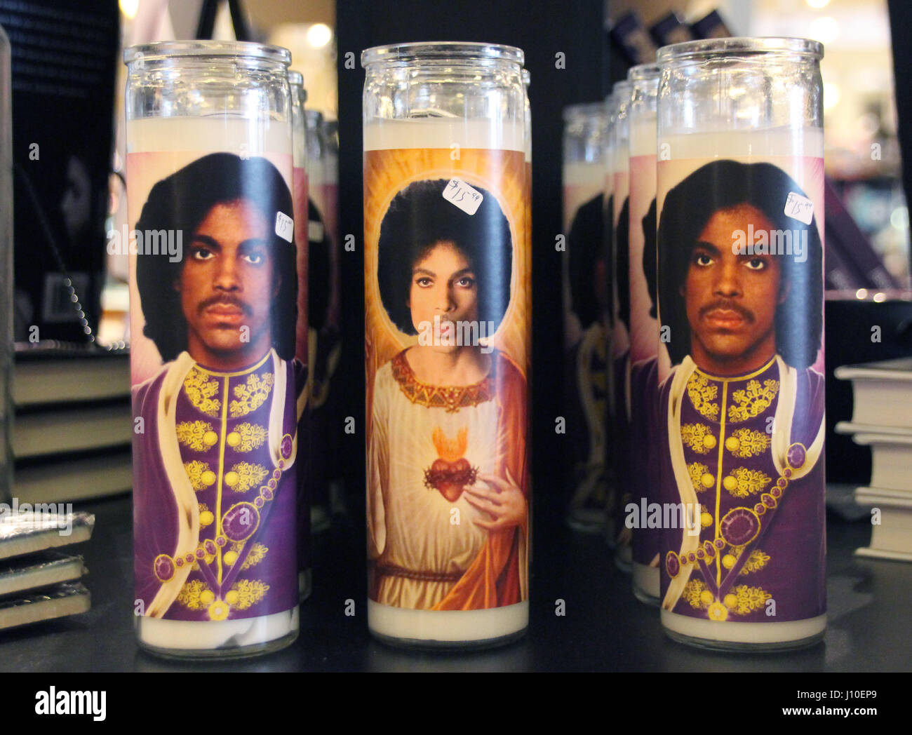 Minneapolis, Minnesota, USA. 13th Apr, 2017. Commemorative candles with the picture of the musician Prince in the 'Electric Fetus' record store in Minneapolis, Minnesota, USA, 13 April 2017. On April 21st, 2016 died the american pop-star at his estate in Chanhassen, Minnesota, of an accidental overdose of the analgesic Fentanyl. Photo: Christina Horsten/dpa/Alamy Live News Stock Photo