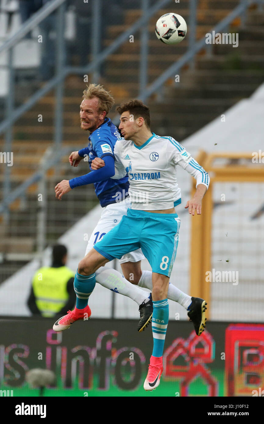 Schalke'S Leon Goretzka (R) and Darmstadt's Jan Rosenthal (L) fight for the ball during the German Bundesliga soccer match between Darmstadt 98 and FC Schalke 04 in the Jonathan Heimes Stadium in Darmstadt, Germany, 16 April 2017. Photo: Thomas Frey/dpa Stock Photo