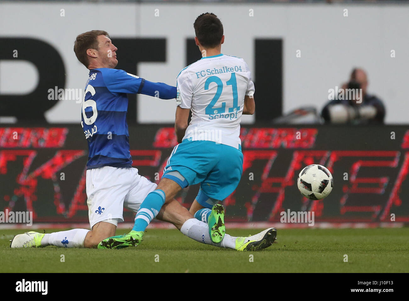 Schalke's Alessandro Schöpf (R) and Darmstadt's Patrick Banggaard fight for the ball during the German Bundesliga soccer match between Darmstadt 98 and FC Schalke 04 in the Jonathan Heimes Stadium in Darmstadt, Germany, 16 April 2017. Photo: Thomas Frey/dpa Stock Photo