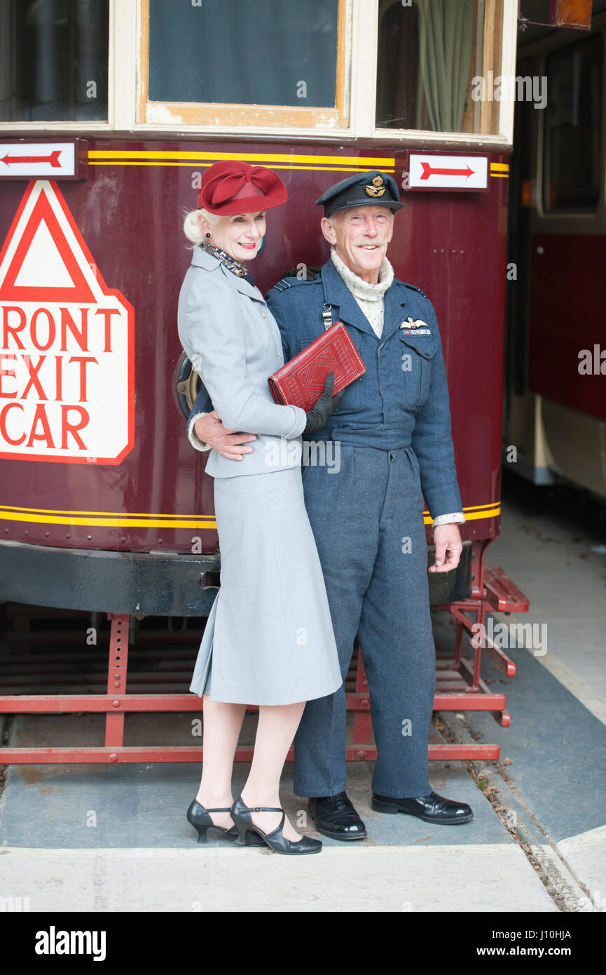 Critch Tramway Village, Derbyshire, UK. WWII Home Front Event.  A couple in 1940s clothing pose in front of a tram Credit: lee avison/Alamy Live News Stock Photo