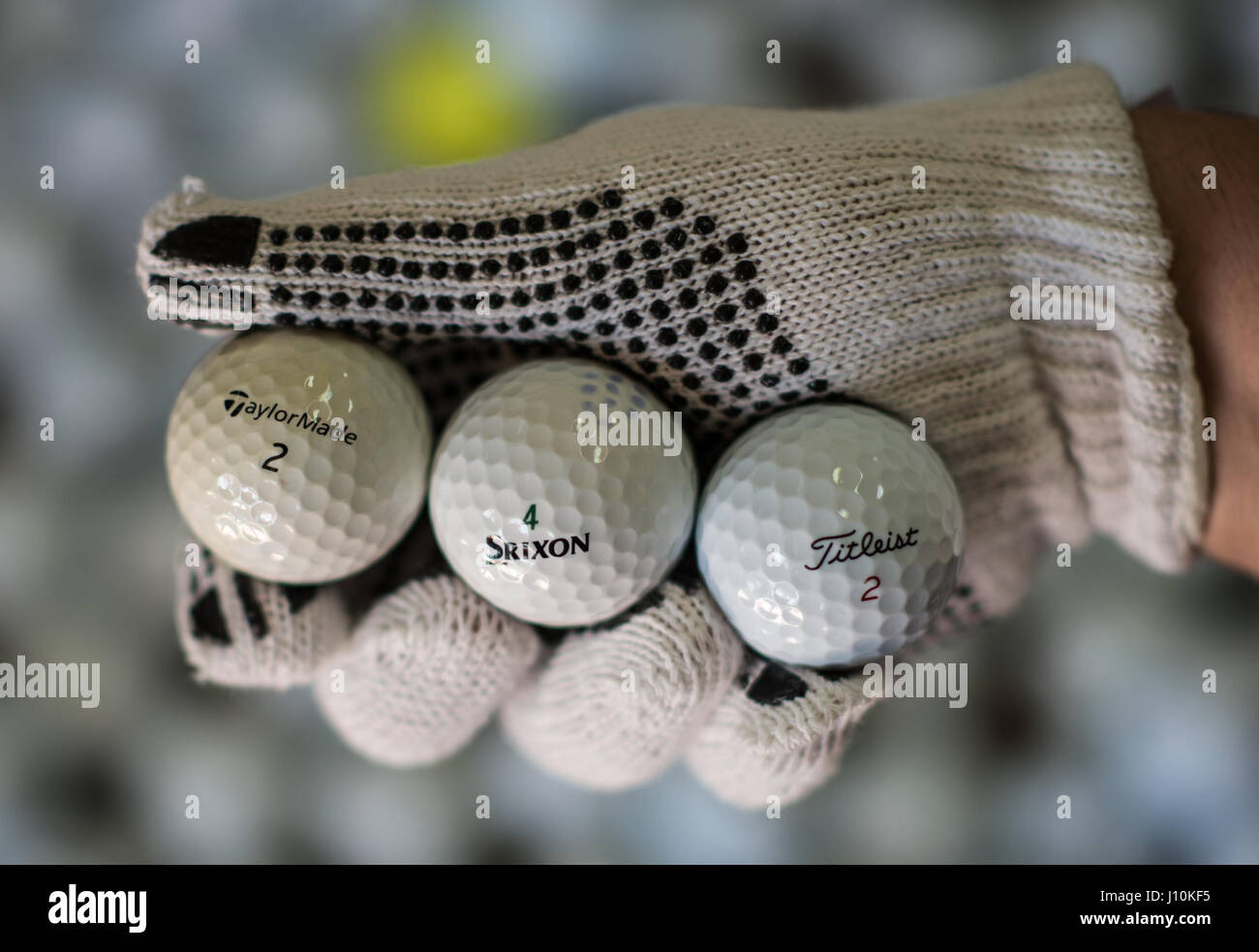 Wiesbaden, Germany. 11th Apr, 2017. Three golf balls displaying varying  degrees of wear and tear in Wiesbaden, Germany, 11 April 2017.  Easy-Lakeballs specialises in recovering and reselling golf balls. The  balls are