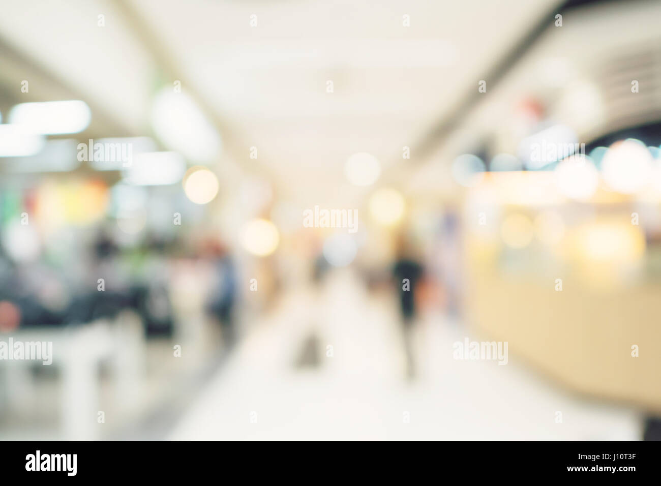 Defocused blur background. People shopping in department store. Stock Photo