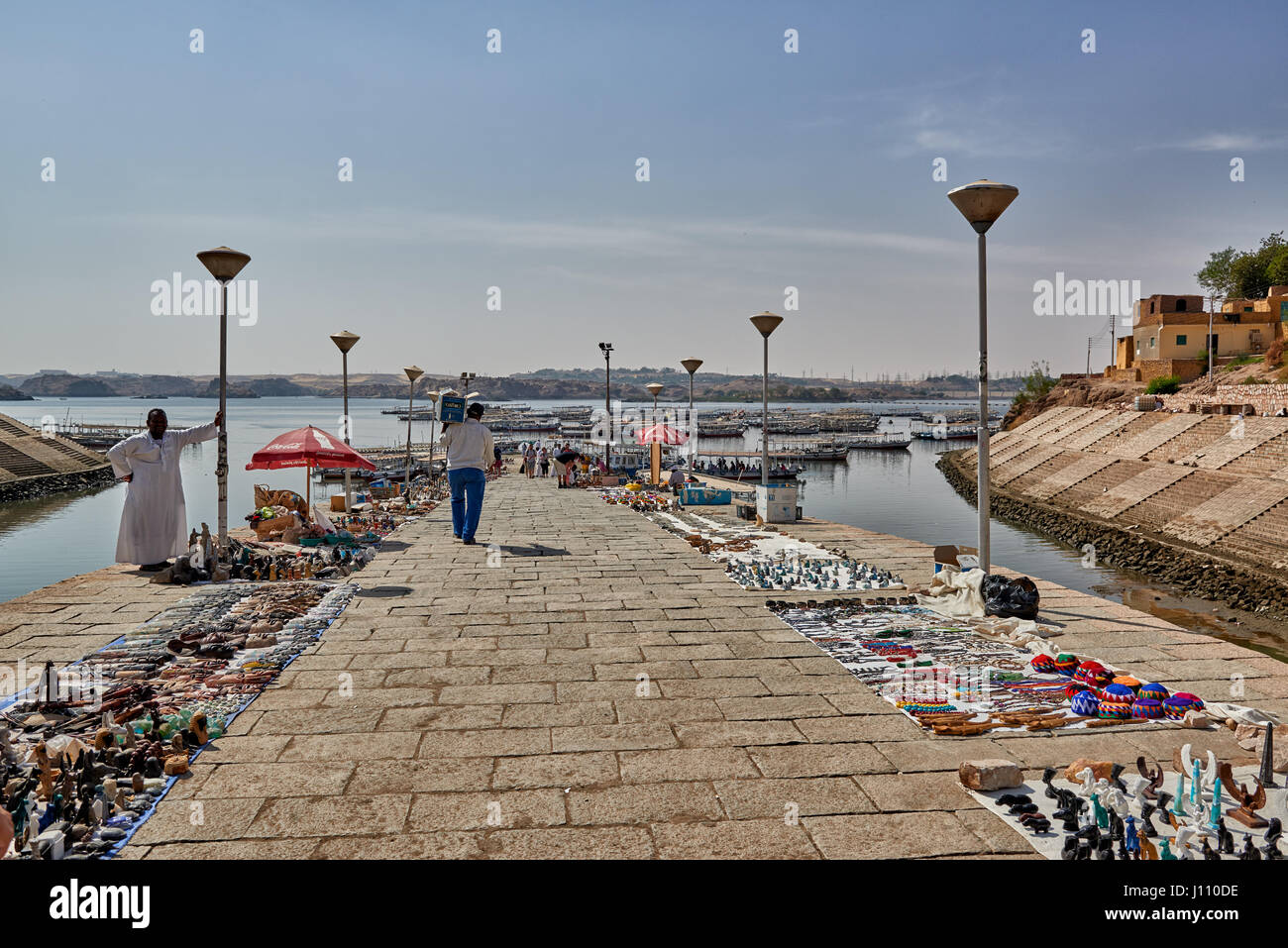 Traders and boats on jetty are waiting for tourists to Philae, Aswan , Egypt, Africa Stock Photo