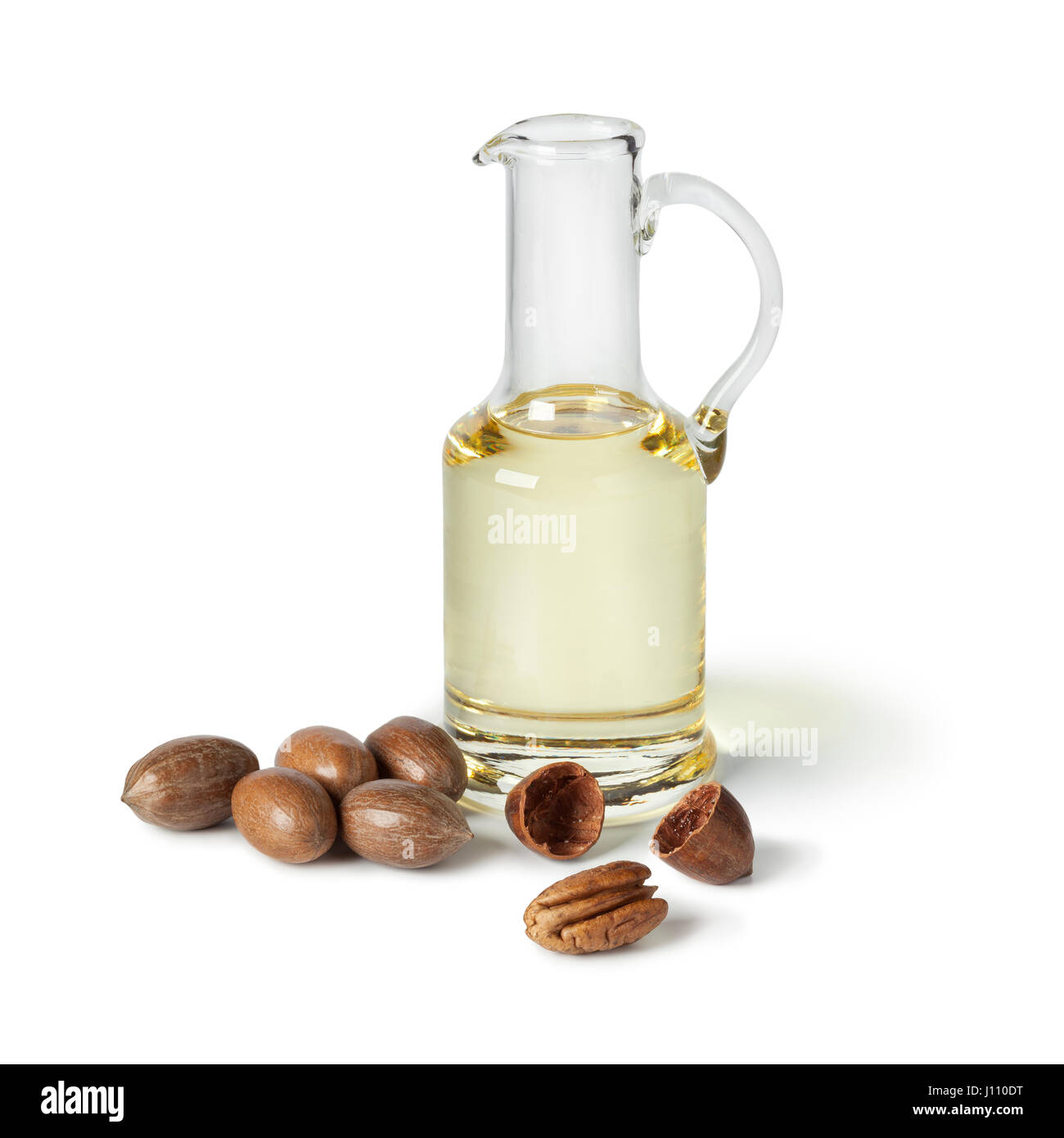 Glass can with pecan oil on white background Stock Photo