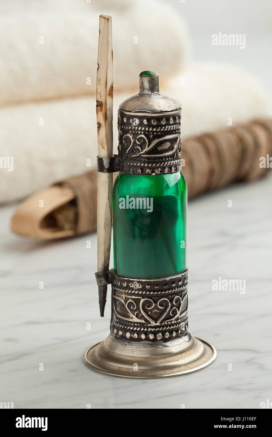 Traditional Moroccan green bottle with black kohl Stock Photo