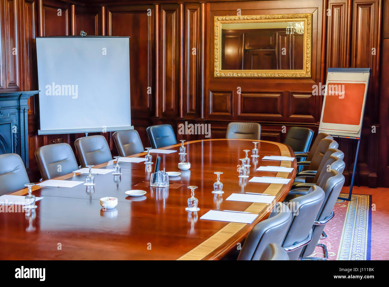 Large Wooden Table In A Board Room With Wood Panelling Set
