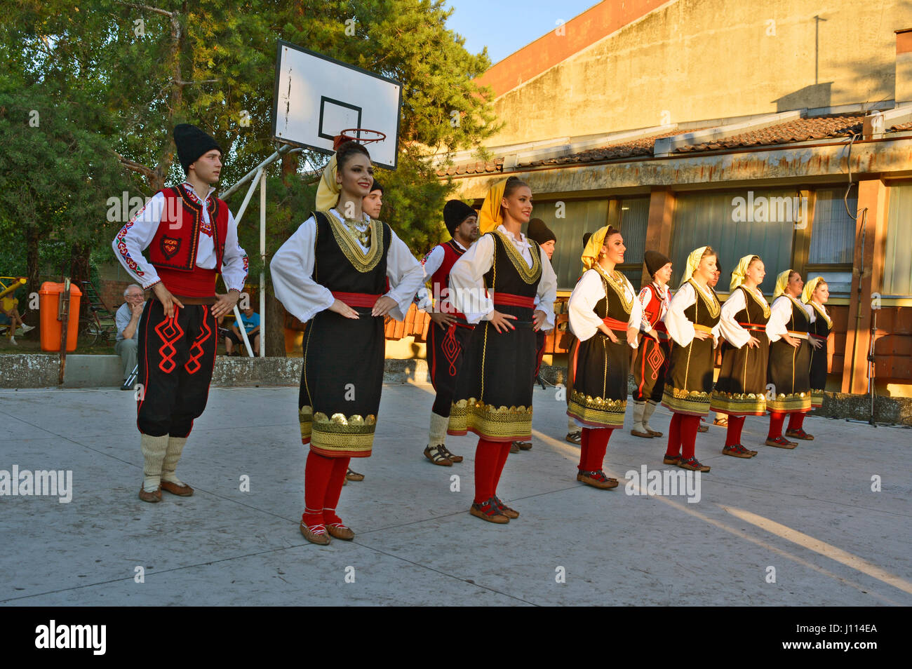 Ivanovo, Serbia, August 15, 2016. The group of young people dancing traditional folk dances from the region of Serbia. Stock Photo