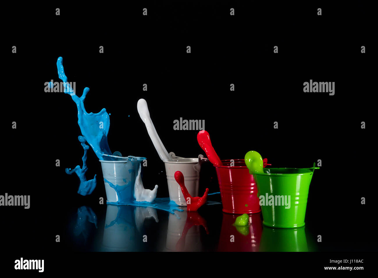 Metal buckets filled with multi coloured acrylic paint Stock Photo Alamy