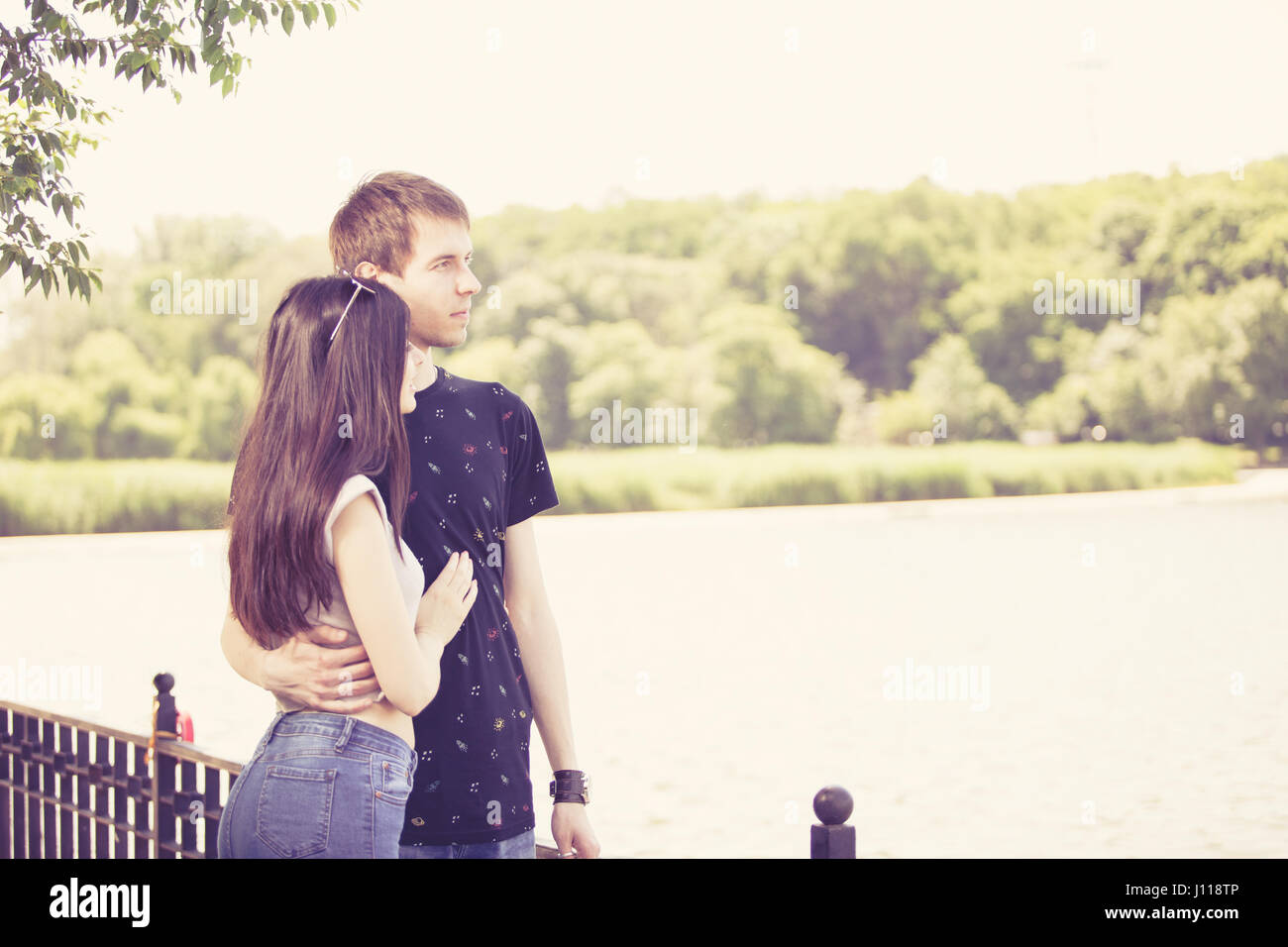 Happy couple taking a walk in the park Stock Photo - Alamy