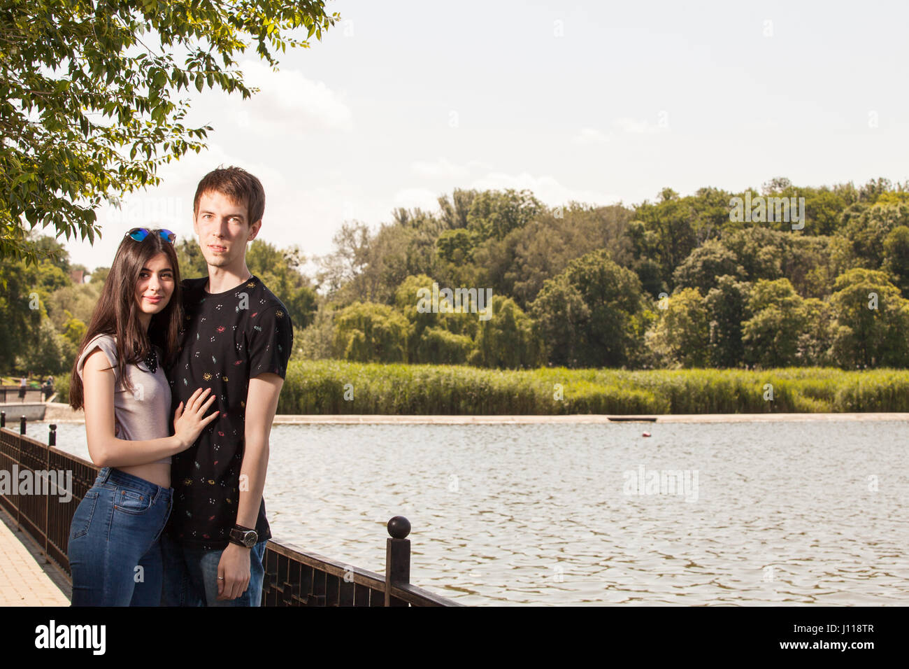 Happy couple taking a walk in the park Stock Photo - Alamy