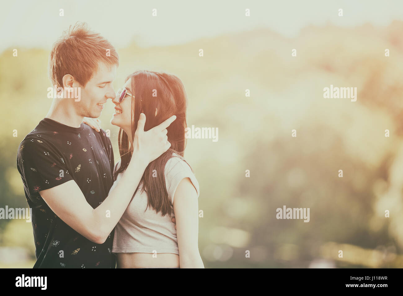 Beautiful couple taking a walk in the park Stock Photo - Alamy
