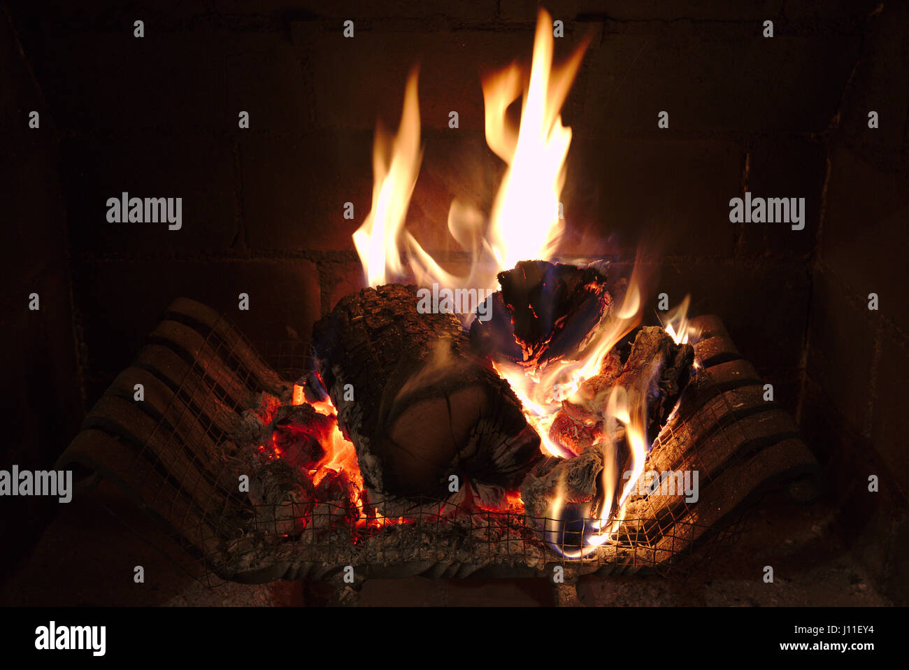 Logs burning in a fireplace Stock Photo